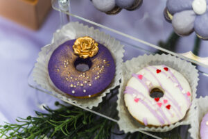 purple custom donuts with golden plated flower topping decoration dessert by idocatering