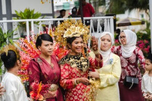 The bride is smiling happily on her wedding