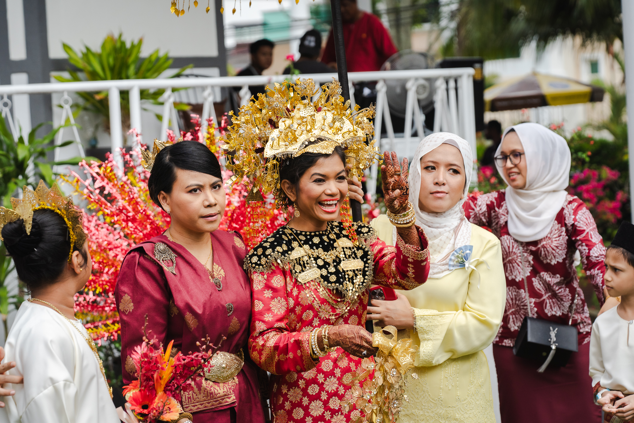 The bride is smiling happily on her wedding