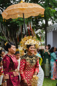 Bride smiling brightly on her malay style premium wedding assisted by idocatering