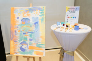 Guests draw and paint station for bride and groom newlyweds future at wedding catering reception event by iDoCatering